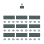 Tables in two columns with three chairs behind each table with speaker in front. 