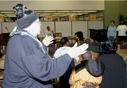 Choir director conducting members. 
