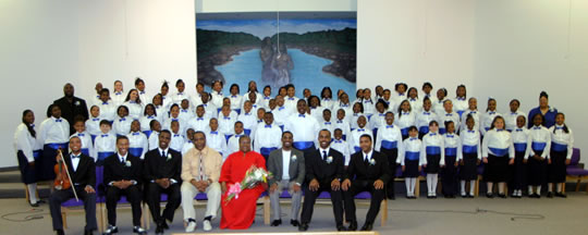 Group photo of choir and choir directors. 
