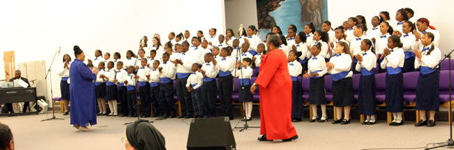 A large choir singing on risers. 