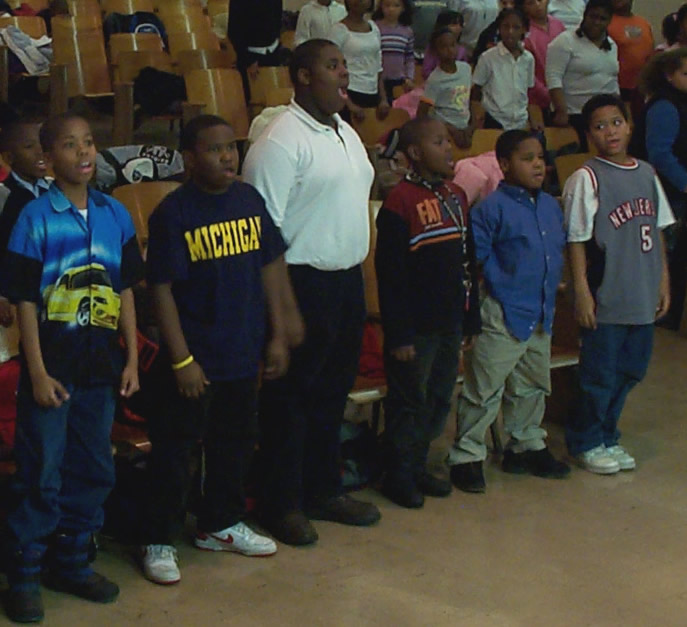 Young boys singing at choir rehearsal. 