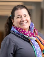 A headshot photo of Director of Library Operations Leslie Acevedo