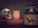 A picture of a skull and potion bottle 