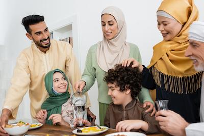 A Muslim family around the dinner table 