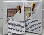 Photo of books wrapped with brief descriptions, packaged with tea bags, pen and stickers.