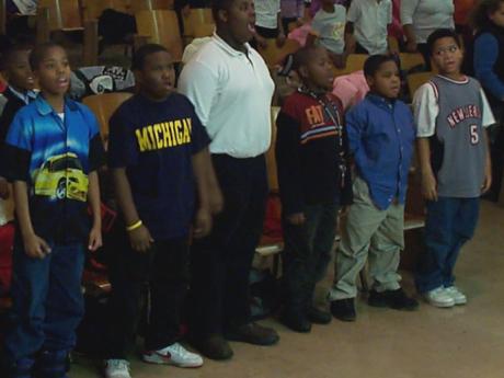 Young boys singing at choir rehearsal. 
