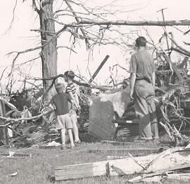 Family amongst the damage of the tornado