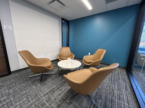 Study Room with four lounge chairs and coffee table.